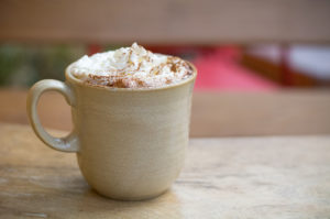 A hot chocolate with whipping cream.